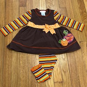 Pumpkin striped dress and leggings.